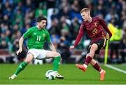 23 March 2024; Arthur Vermeeren of Belgium in action against Robbie Brady of Republic of Ireland during the international friendly match between Republic of Ireland and Belgium at the Aviva Stadium in Dublin. Photo by Stephen McCarthy/Sportsfile