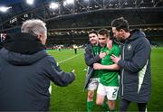 23 March 2024; Seamus Coleman of Republic of Ireland with team-mate Robbie Brady, assistant coach Paddy McCarthy, right, and technical advisor Brian Kerr, left, after the international friendly match between Republic of Ireland and Belgium at the Aviva Stadium in Dublin. Photo by Stephen McCarthy/Sportsfile
