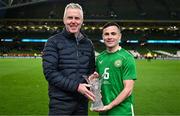 23 March 2024; Josh Cullen of Republic of Ireland is presented with the player of the match award by Sky Ireland CEO JD Buckley after the international friendly match between Republic of Ireland and Belgium at the Aviva Stadium in Dublin. Photo by Stephen McCarthy/Sportsfile Photo by Stephen McCarthy/Sportsfile