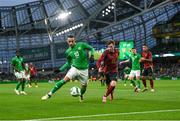 23 March 2024; Adam Idah of Republic of Ireland in action against Olivier Deman of Belgium during the international friendly match between Republic of Ireland and Belgium at the Aviva Stadium in Dublin. Photo by Stephen McCarthy/Sportsfile