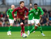 23 March 2024; Olivier Deman of Belgium and Chiedozie Ogbene of Republic of Ireland during the international friendly match between Republic of Ireland and Belgium at the Aviva Stadium in Dublin. Photo by Stephen McCarthy/Sportsfile