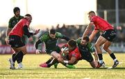 23 March 2024; Jordan Hendrikse of Emirates Lions is tackled by JJ Hanrahan, right, and Andrew Smith of Connacht during the United Rugby Championship match between Connacht and Emirates Lions at Dexcom Stadium in Galway. Photo by Piaras Ó Mídheach/Sportsfile