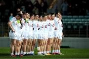 23 March 2024; Kildare players stand for a minute's silence before during the Allianz Football League Division 2 match between Kildare and Louth at Netwatch Cullen Park in Carlow. Photo by Michael P Ryan/Sportsfile