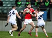 23 March 2024; Dermot Campbell of Louth in action against Kildare players Jack Sargent, left, and Luke Killian during the Allianz Football League Division 2 match between Kildare and Louth at Netwatch Cullen Park in Carlow. Photo by Michael P Ryan/Sportsfile