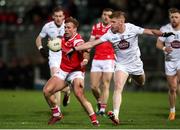 23 March 2024; Conor Grimes of Louth in action against Shane Farrell of Kildare during the Allianz Football League Division 2 match between Kildare and Louth at Netwatch Cullen Park in Carlow. Photo by Michael P Ryan/Sportsfile