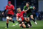 23 March 2024; JC Pretorius of Emirates Lions is tackled by Jack Carty, right, and Cian Prendergast of Connacht during the United Rugby Championship match between Connacht and Emirates Lions at Dexcom Stadium in Galway. Photo by Piaras Ó Mídheach/Sportsfile