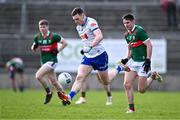 24 March 2024; Killian Lavelle of Monaghan in action against Enda Hession of Mayo during the Allianz Football League Division 1 match between Monaghan and Mayo at St Tiernach's Park in Clones, Monaghan. Photo by Ben McShane/Sportsfile