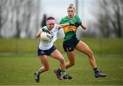 24 March 2024; Karen O'Leary of Limerick in action against Elise Bruen of Leitrim during the Lidl LGFA National League Division 4 semi-final match between Leitrim and Limerick at Pádraig Pearses GAA Club in Roscommon. Photo by Seb Daly/Sportsfile
