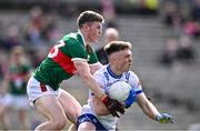24 March 2024; Ciaran McNulty of Monaghan is tackled by Eoin O'Donoghue of Mayo during the Allianz Football League Division 1 match between Monaghan and Mayo at St Tiernach's Park in Clones, Monaghan. Photo by Ben McShane/Sportsfile