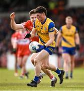 24 March 2024; Patrick Gavin of Roscommon in action against Ethan Doherty of Derry during the Allianz Football League Division 1 match between Derry and Roscommon at Celtic Park in Derry. Photo by Ramsey Cardy/Sportsfile