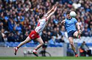 24 March 2024; Killian McGinnis of Dublin shoots to score his side's sixth point despite the efforts of Aidan Clarke of Tyrone during the Allianz Football League Division 1 match between Dublin and Tyrone at Croke Park in Dublin. Photo by Shauna Clinton/Sportsfile