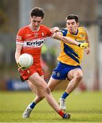 24 March 2024; Paul Cassidy of Derry in action against Ruaidhrí Fallon of Roscommon during the Allianz Football League Division 1 match between Derry and Roscommon at Celtic Park in Derry. Photo by Ramsey Cardy/Sportsfile