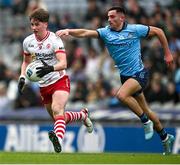 24 March 2024; Aodhan Donaghy of Tyrone is tackled by Tom Lahiff of Dublin during the Allianz Football League Division 1 match between Dublin and Tyrone at Croke Park in Dublin. Photo by Ray McManus/Sportsfile