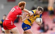 24 March 2024; Ultan Harney of Roscommon in action against Conor Glass of Derry during the Allianz Football League Division 1 match between Derry and Roscommon at Celtic Park in Derry. Photo by Ramsey Cardy/Sportsfile