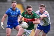 24 March 2024; Padraig O'Hora of Mayo is tackled by Colm Lennon of Monaghan during the Allianz Football League Division 1 match between Monaghan and Mayo at St Tiernach's Park in Clones, Monaghan. Photo by Ben McShane/Sportsfile