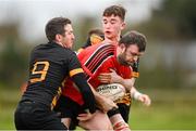 24 March 2024; Pádraig Wall of Cill Dara is tackled by Sean Lambe, right, and Gavin Kennedy of Ashbourne during the Bank of Ireland Provincial Towns Cup Third Round match between Cill Dara RFC and Ashbourne RFC at Cill Dara RFC in Kildare. Photo by David Fitzgerald/Sportsfile