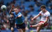 24 March 2024; Tiernan Quinn of Tyrone scores a point despite the efforts of Tom Lahiff of Dublin during the Allianz Football League Division 1 match between Dublin and Tyrone at Croke Park in Dublin. Photo by Shauna Clinton/Sportsfile