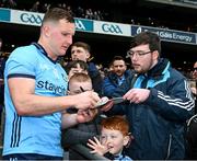 24 March 2024; Ciarán Kilkenny of Dublin signs his autograph for a supporter after the Allianz Football League Division 1 match between Dublin and Tyrone at Croke Park in Dublin. Photo by Ray McManus/Sportsfile