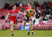 24 March 2024; Cian Connolly of Roscommon in action against Conor McCluskey of Derry during the Allianz Football League Division 1 match between Derry and Roscommon at Celtic Park in Derry. Photo by Ramsey Cardy/Sportsfile