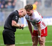 24 March 2024; Tiernan Quinn of Tyrone is booked by referee Barry Cassidy during the Allianz Football League Division 1 match between Dublin and Tyrone at Croke Park in Dublin. Photo by Ray McManus/Sportsfile