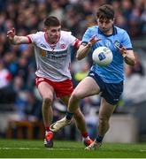 24 March 2024; Brian O'Leary of Dublin is tackled by Niall Devlin of Tyrone during the Allianz Football League Division 1 match between Dublin and Tyrone at Croke Park in Dublin. Photo by Ray McManus/Sportsfile