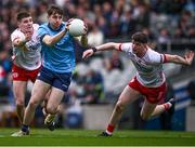 24 March 2024; Brian O'Leary of Dublin is tackled by Niall Devlin, left, and Aidan Clarke of Tyrone during the Allianz Football League Division 1 match between Dublin and Tyrone at Croke Park in Dublin. Photo by Ray McManus/Sportsfile