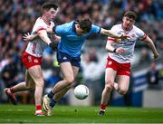 24 March 2024; Brian O'Leary of Dublin is tackled by Ciarán Daly, left, and Michael McGleenan of Tyrone during the Allianz Football League Division 1 match between Dublin and Tyrone at Croke Park in Dublin. Photo by Ray McManus/Sportsfile