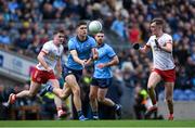 24 March 2024; Theo Clancy of Dublin in action against Ruairí Canavan, left, and Lorcan McGarrity of Tyrone during the Allianz Football League Division 1 match between Dublin and Tyrone at Croke Park in Dublin. Photo by Shauna Clinton/Sportsfile