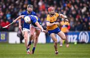 24 March 2024; Darragh Lohan of Clare in action against Michael Breen of Tipperary during the Allianz Hurling League Division 1 semi-final match between Clare and Tipperary at Laois Hire O'Moore Park in Portlaoise, Laois. Photo by Piaras Ó Mídheach/Sportsfile