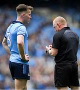 24 March 2024; Referee Barry Cassidy notes the name of Dáire Newcombe of Dublin during the Allianz Football League Division 1 match between Dublin and Tyrone at Croke Park in Dublin. Photo by Shauna Clinton/Sportsfile