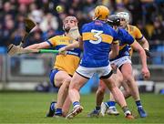 24 March 2024; Peter Duggan of Clare in action against Ronan Maher, 3, and Dan McCormack of Tipperary during the Allianz Hurling League Division 1 semi-final match between Clare and Tipperary at Laois Hire O'Moore Park in Portlaoise, Laois. Photo by Piaras Ó Mídheach/Sportsfile
