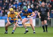 24 March 2024; Robert Byrne of Tipperary in action against Mark Rodgers of Clare during the Allianz Hurling League Division 1 semi-final match between Clare and Tipperary at Laois Hire O'Moore Park in Portlaoise, Laois. Photo by Piaras Ó Mídheach/Sportsfile