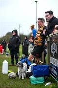 24 March 2024; James McCaghy of Ashbourne looks on with his dog during the Bank of Ireland Provincial Towns Cup Third Round match between Cill Dara RFC and Ashbourne RFC at Cill Dara RFC in Kildare. Photo by David Fitzgerald/Sportsfile