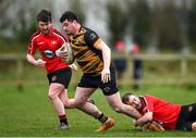 24 March 2024; Neil Reilly of Ashbourne is tackled by Ross Dooley of Cill Dara during the Bank of Ireland Provincial Towns Cup Third Round match between Cill Dara RFC and Ashbourne RFC at Cill Dara RFC in Kildare. Photo by David Fitzgerald/Sportsfile