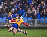 24 March 2024; Jake Morris of Tipperary and Adam Hogan of Clare tussle during the Allianz Hurling League Division 1 semi-final match between Clare and Tipperary at Laois Hire O'Moore Park in Portlaoise, Laois. Photo by Piaras Ó Mídheach/Sportsfile