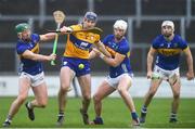 24 March 2024; David Fitzgerald of Clare is tackled by Tipperary players, Robert Byrne, left and Michael Breen during the Allianz Hurling League Division 1 semi-final match between Clare and Tipperary at Laois Hire O'Moore Park in Portlaoise, Laois. Photo by John Sheridan/Sportsfile