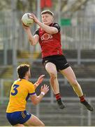 24 March 2024; Odhran Murddock of Down in action against Ronan Lanigan of Clare during the Allianz Football League Division 3 match between Down and Clare at Páirc Esler in Newry, Down. Photo by Matt Browne/Sportsfile