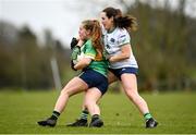 24 March 2024; Muireann Devaney of Leitrim in action against Grace Lee of Limerick during the Lidl LGFA National League Division 4 semi-final match between Leitrim and Limerick at Pádraig Pearses GAA Club in Roscommon. Photo by Seb Daly/Sportsfile