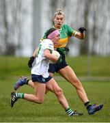 24 March 2024; Karen O'Leary of Limerick in action against Elise Bruen of Leitrim during the Lidl LGFA National League Division 4 semi-final match between Leitrim and Limerick at Pádraig Pearses GAA Club in Roscommon. Photo by Seb Daly/Sportsfile