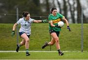 24 March 2024; Vivienne Egan of Leitrim in action against Grace Lee of Limerick during the Lidl LGFA National League Division 4 semi-final match between Leitrim and Limerick at Pádraig Pearses GAA Club in Roscommon. Photo by Seb Daly/Sportsfile