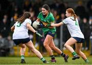 24 March 2024; Vivienne Egan of Leitrim in action against Limerick players Grace Lee, left, and Fiona Bradshaw during the Lidl LGFA National League Division 4 semi-final match between Leitrim and Limerick at Pádraig Pearses GAA Club in Roscommon. Photo by Seb Daly/Sportsfile