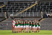 24 March 2024; Mayo players stand for a moment of silence before the Allianz Football League Division 1 match between Monaghan and Mayo at St Tiernach's Park in Clones, Monaghan. Photo by Ben McShane/Sportsfile