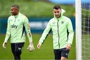 25 March 2024; Seamus Coleman and goalkeeper Gavin Bazunu, left, during a Republic of Ireland training session at FAI National Training Centre in Abbotstown, Dublin. Photo by Stephen McCarthy/Sportsfile