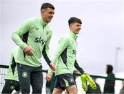25 March 2024; Andy Moran and Jason Knight, left, during a Republic of Ireland training session at FAI National Training Centre in Abbotstown, Dublin. Photo by Stephen McCarthy/Sportsfile