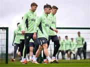 25 March 2024; Joe Hodge with Nathan Collins, left, and Evan Ferguson, right, during a Republic of Ireland training session at FAI National Training Centre in Abbotstown, Dublin. Photo by Stephen McCarthy/Sportsfile