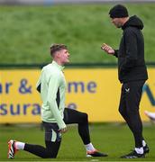 25 March 2024; Interim head coach John O'Shea with Evan Ferguson during a Republic of Ireland training session at FAI National Training Centre in Abbotstown, Dublin. Photo by Stephen McCarthy/Sportsfile