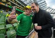 26 March 2024; Republic of Ireland interim head coach John O'Shea has a selfie taken with Republic of Ireland supporter Eoghan O'Donnell, from Roscrea, Tipperary, before the international friendly match between Republic of Ireland and Switzerland at the Aviva Stadium in Dublin. Photo by Stephen McCarthy/Sportsfile