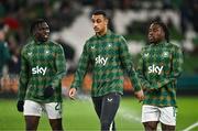 26 March 2024; Republic of Ireland players, from left, Festy Ebosele, Adam Idah and Michael Obafemi before the international friendly match between Republic of Ireland and Switzerland at the Aviva Stadium in Dublin. Photo by Ben McShane/Sportsfile