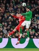 26 March 2024; Michel Aebischer of Switzerland in action against Andrew Omobamidele of Republic of Ireland during the international friendly match between Republic of Ireland and Switzerland at the Aviva Stadium in Dublin. Photo by Stephen McCarthy/Sportsfile