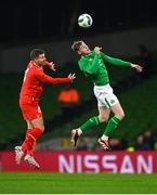 26 March 2024; Evan Ferguson of Republic of Ireland in action against Nico Elvedi of Switzerland during the international friendly match between Republic of Ireland and Switzerland at the Aviva Stadium in Dublin. Photo by Tyler Miller/Sportsfile